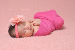 newborn-baby-girl-beautifully-wrapped-in-a-pink-wrap-by-tomas-hric-photography-falls-church-virginia-best-washington-dc-newborn-photographer