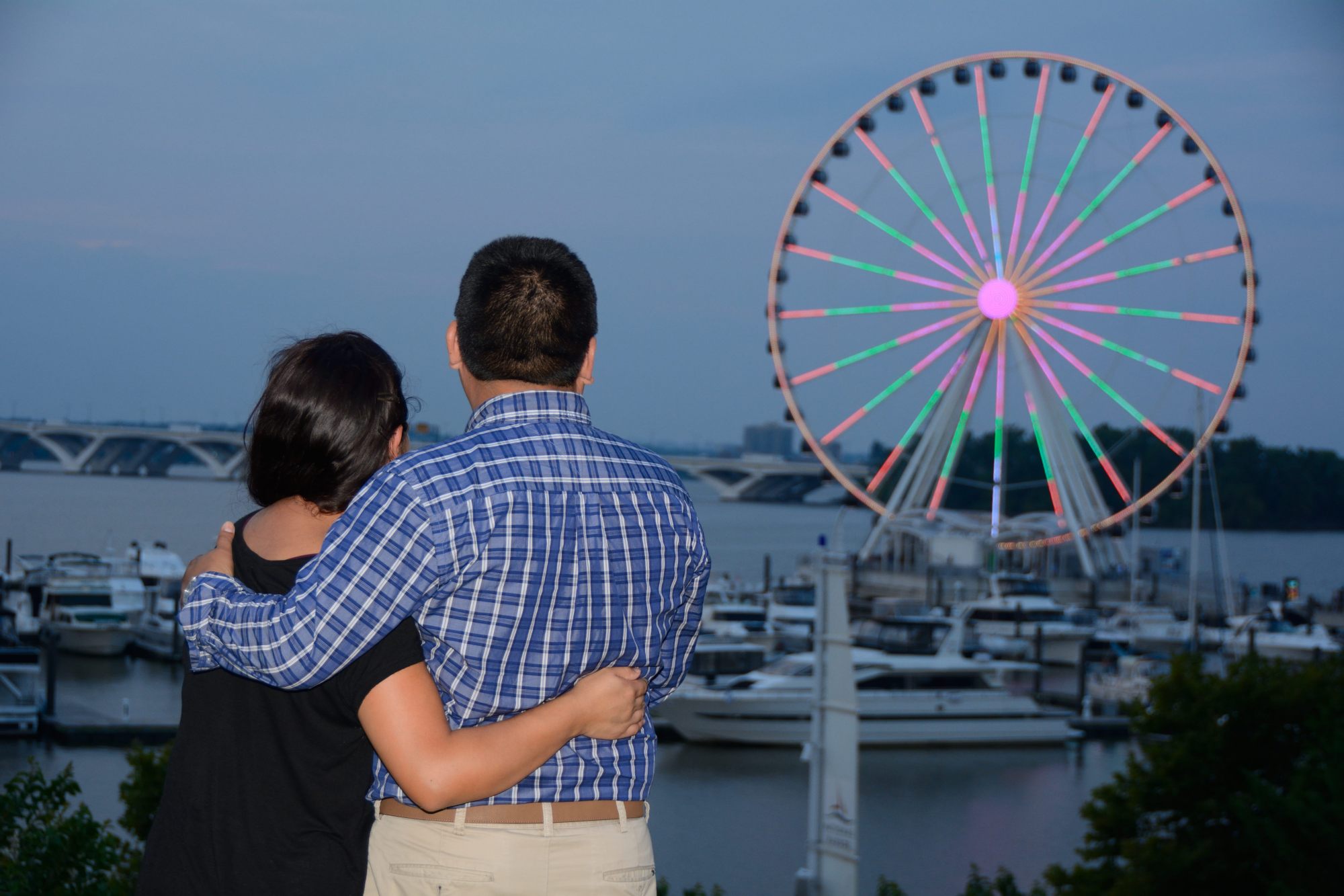 tomas hric photography stunning family and engagement photographer couple looking at ferris wheel