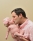 Newborn photo father holding and kissing his daughter laurel maryland