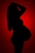 Amazing maternity picture black and red background 9 months expecting mother toms hric photography northern virginia photographer