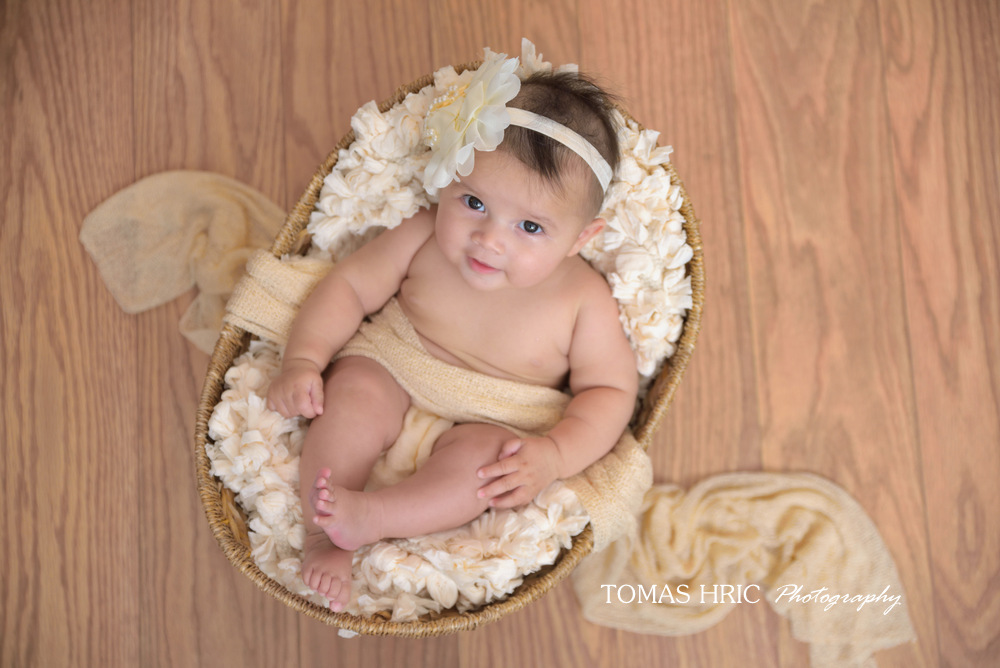 picture-of-newborn-baby-girl-in-a-basket-with-creative-design-by-tomas-hric-photography-arlington-virginia-washington-dc-best-maryland-newborn-photographer