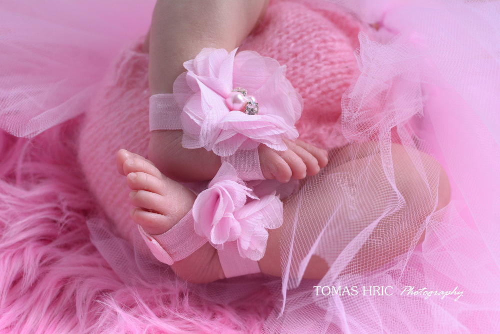 tiny-newborn-feet-in-pink-outfit-and-anklets-by-tomas-hric-photography-falls-church-virginia-best-northern-virginia-newborn-photographer
